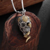 Snake entwined skull necklace