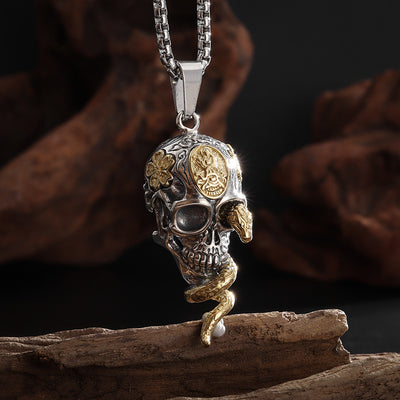 Snake entwined skull necklace